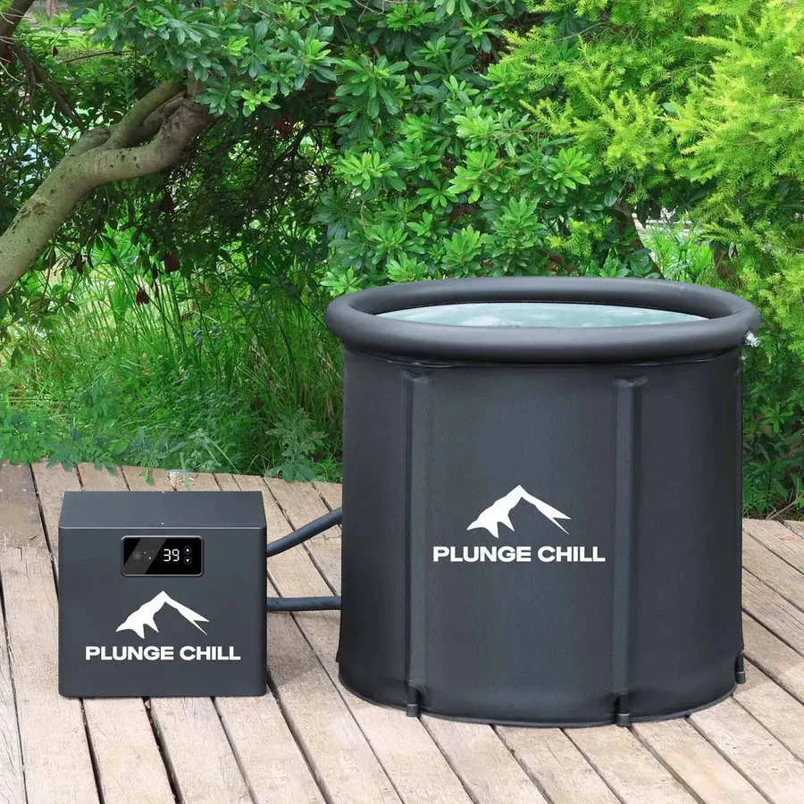 The Plunge Chill setup on a wooden deck: a black collapsible tub full of water beside its compact chiller unit reading 39 degrees, joined by two insulated hoses